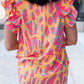 Ruffled Printed V-Neck Cap Sleeve Blouse