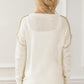 Exposed Seam Round Neck Long Sleeve Sweater