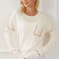 Exposed Seam Round Neck Long Sleeve Sweater